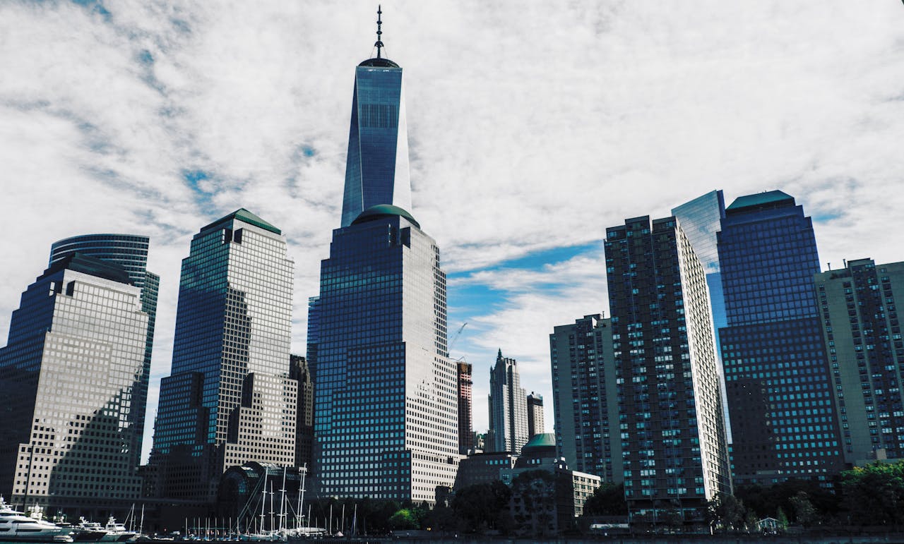 creative-01 Skyline view of New York City featuring the iconic Freedom Tower and surrounding skyscrapers.